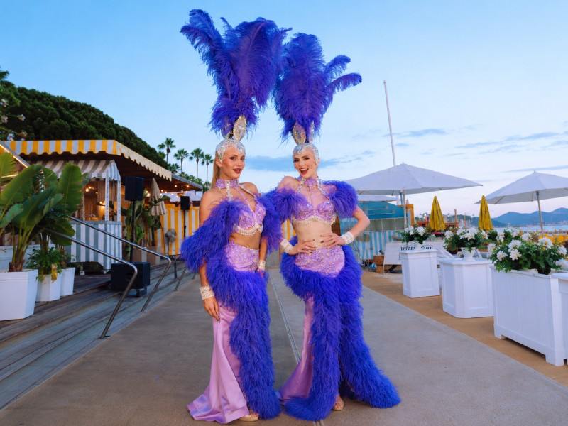 feather headdress performers Cannes, roaming welcome act Cannes beach, feather performers private event French Riviera, luxury entertainment Cannes, entertainment agency Cannes