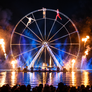 water show, aquatic show, giant wheel show, water circus, outdoor water show, waterfront entertainment, contemporary circus show, floating show, fire and water show, large scale outdoor performance